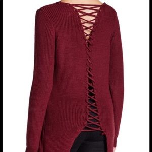 Oversized sweater with lace-up detail in the back